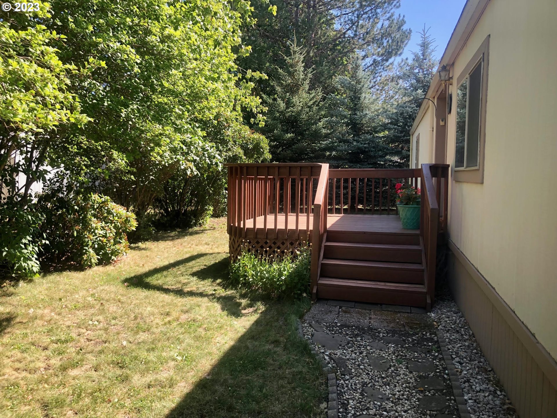 1809 26th Street, Unit 77 La Grande, OR 97850 - Photo 28 of 41 a view of stairs and yard with wooden fence