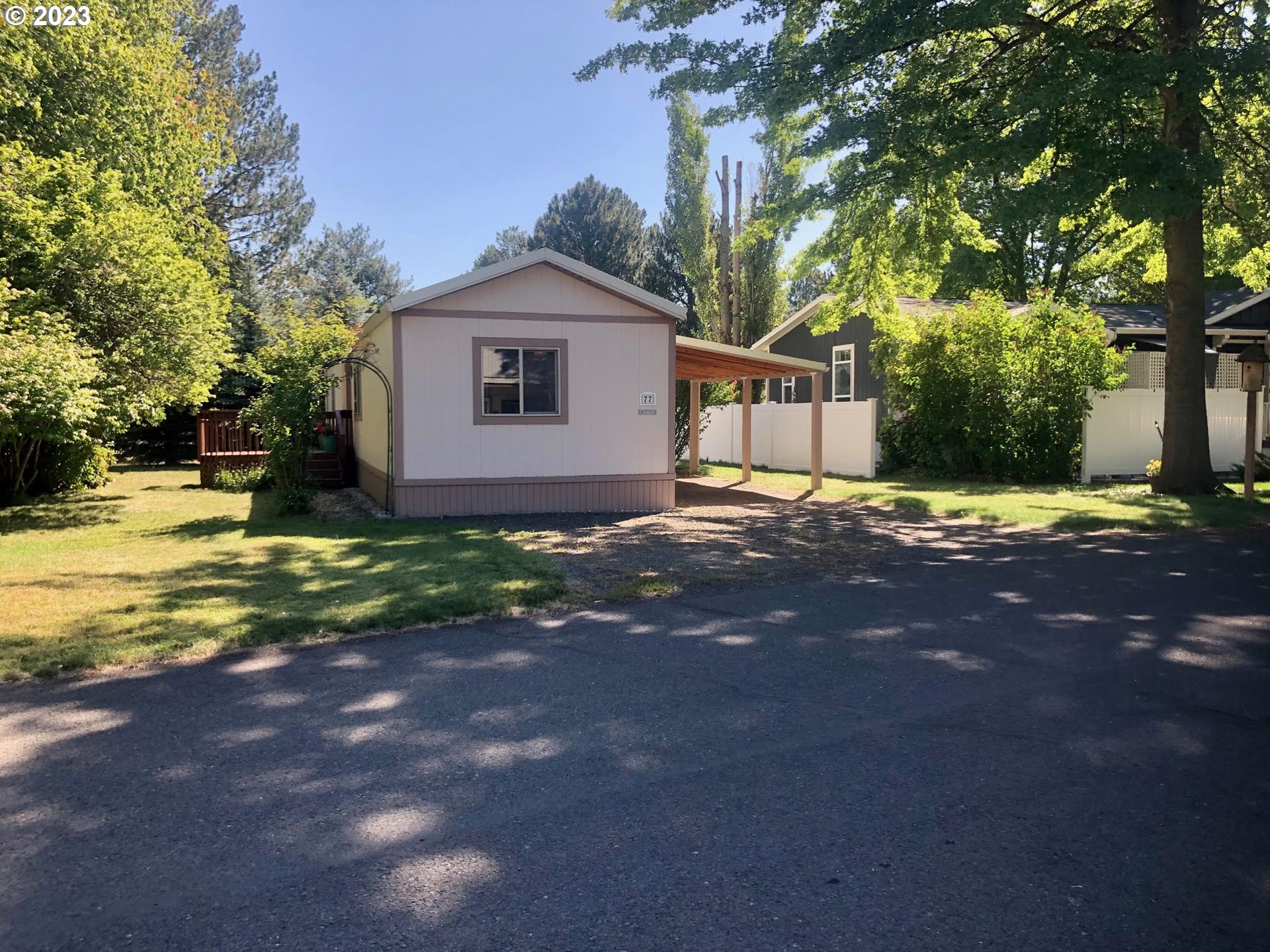 1809 26th Street, Unit 77 La Grande, OR 97850 - Photo 30 of 41 a view of a house with backyard and trees