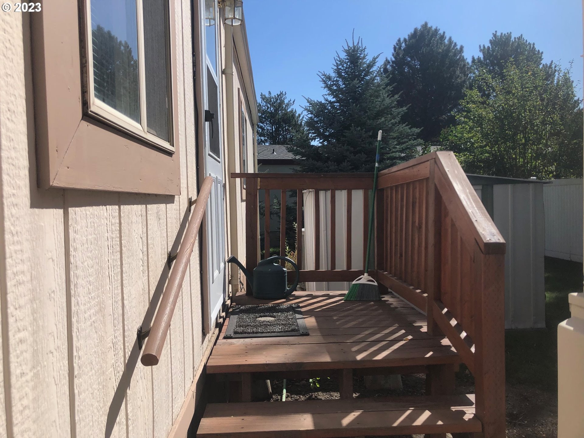 1809 26th Street, Unit 77 La Grande, OR 97850 - Photo 35 of 41 a view of balcony with wooden floor and fence