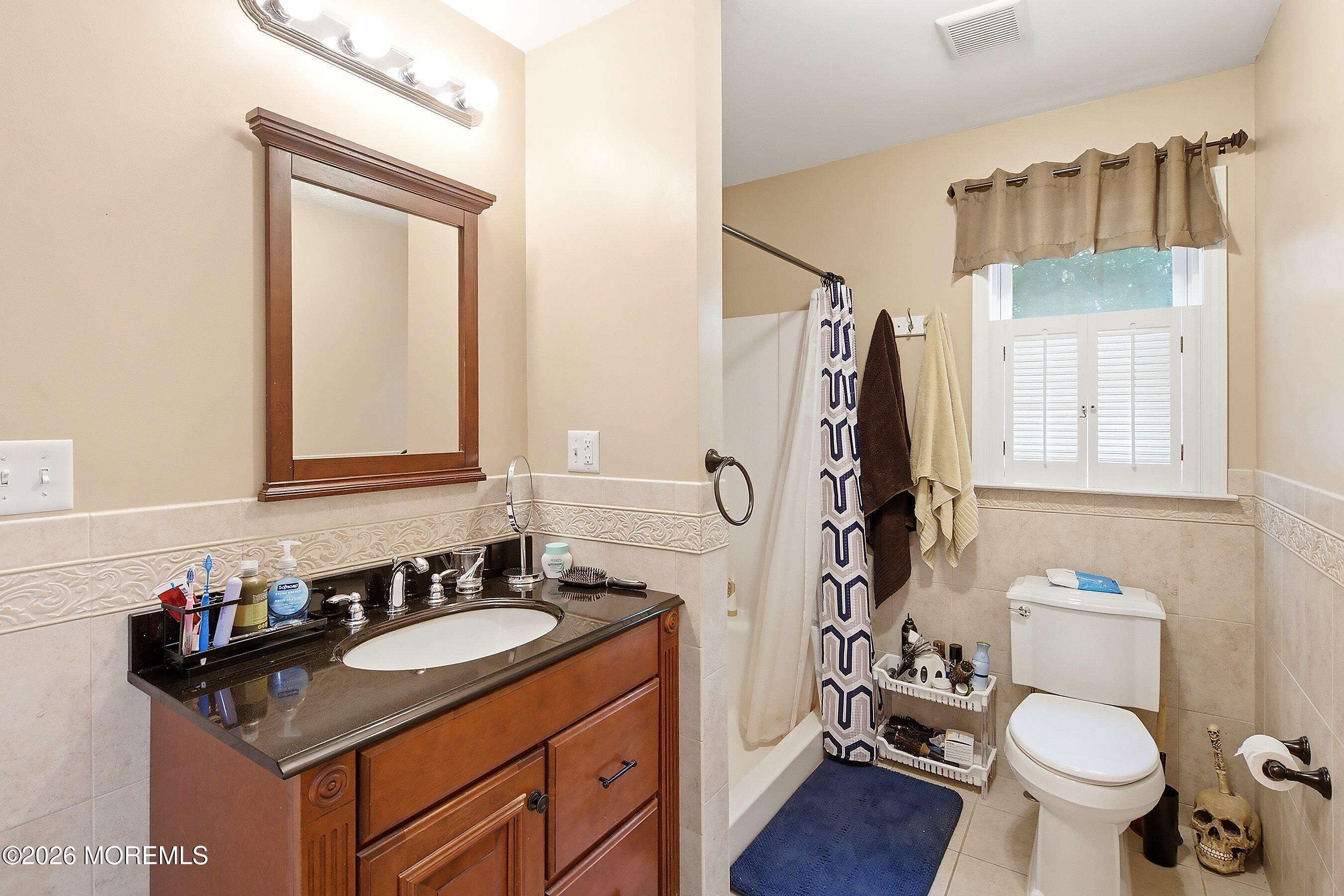 935 Bethel Church Road Jackson, NJ 08527 - Photo 15 of 32 a bathroom with a granite countertop sink toilet and shower