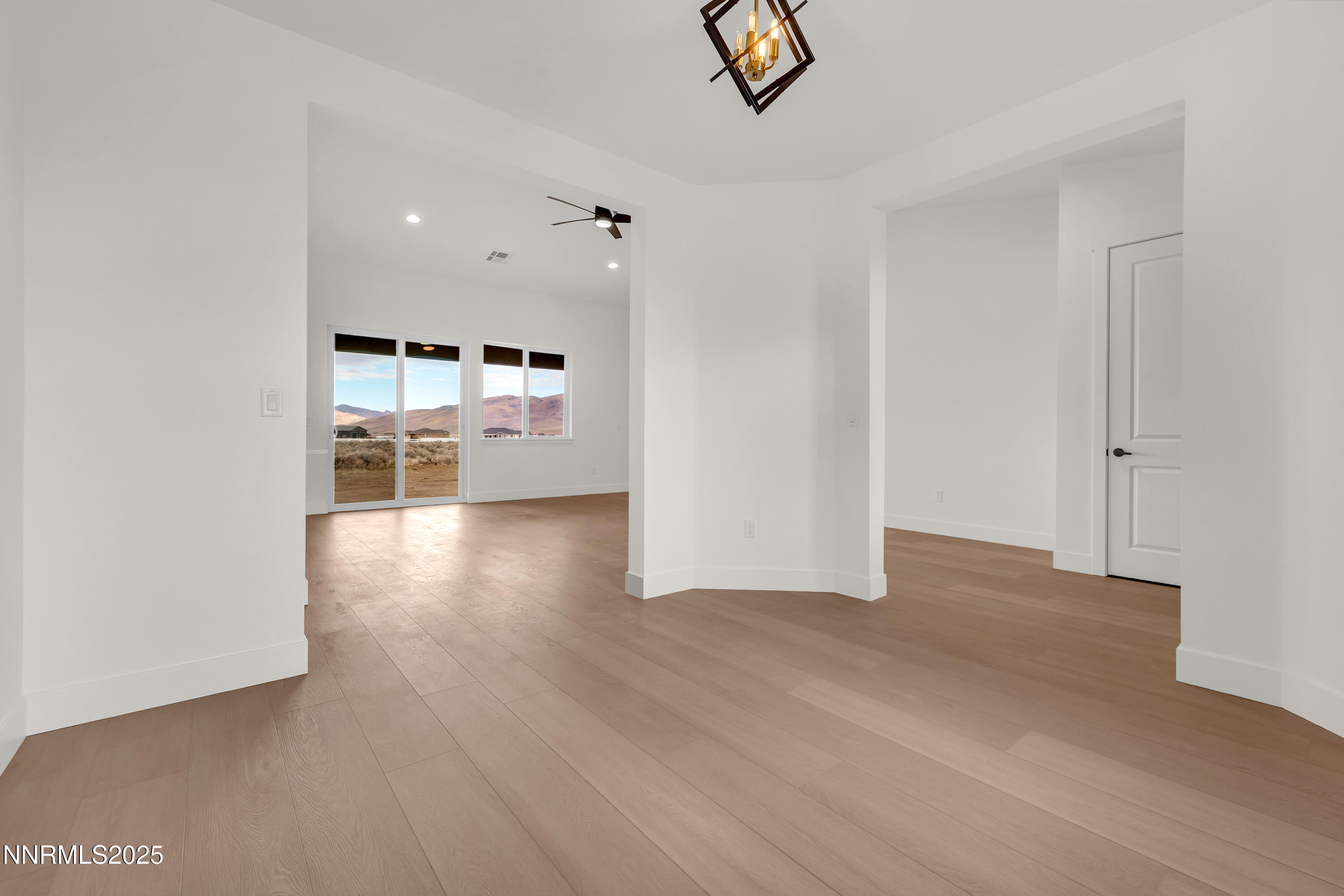205 Pinto Ranch Court Reno, NV 89510 - Photo 3 of 48 wooden floor in an empty room with a window