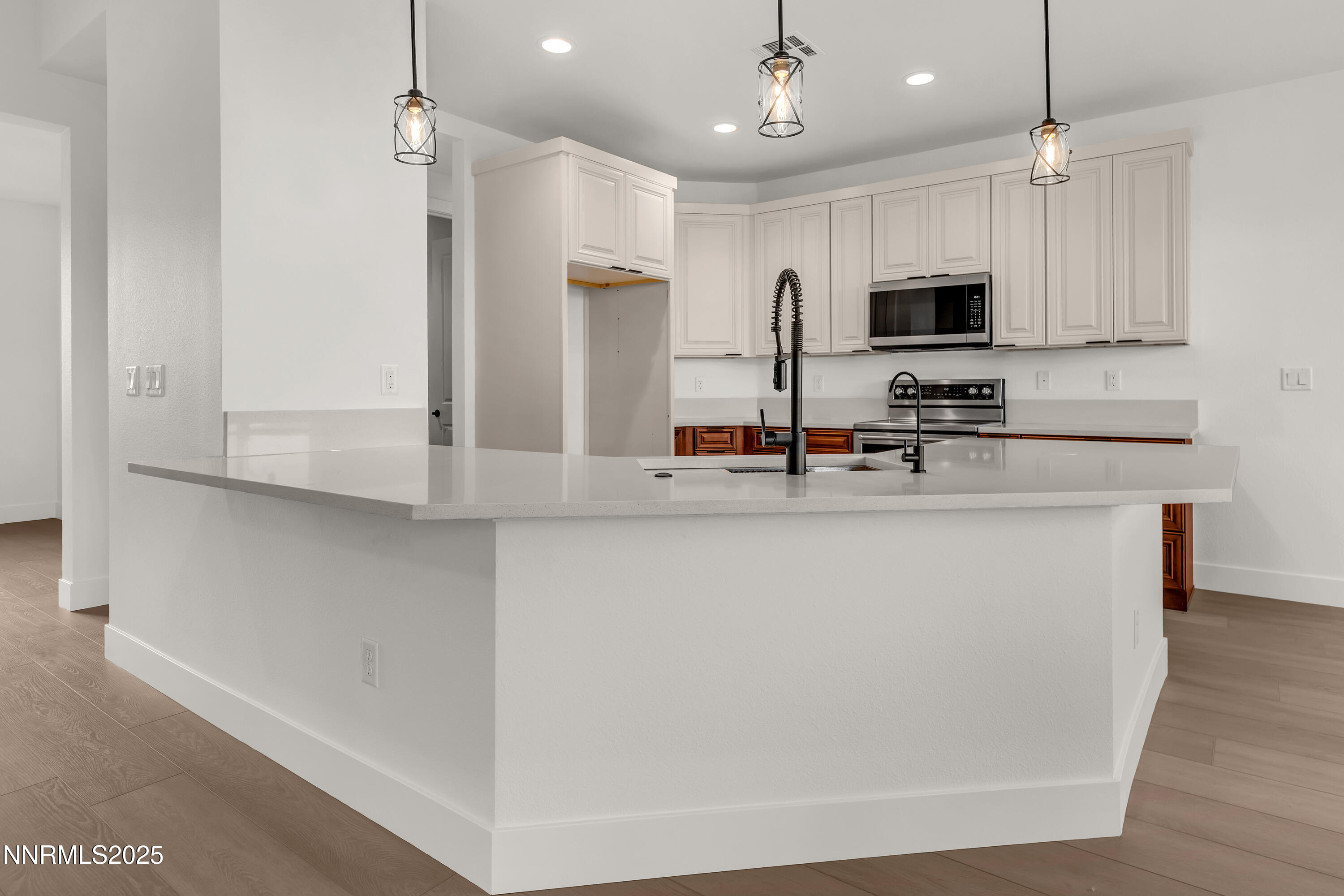 205 Pinto Ranch Court Reno, NV 89510 - Photo 9 of 48 a kitchen with stainless steel appliances a refrigerator sink and microwave