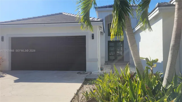 a view of a house with a small yard