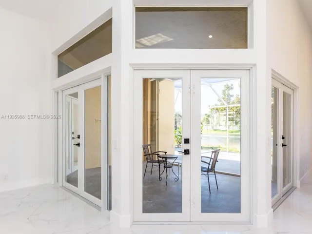 a bedroom with a bed and a table