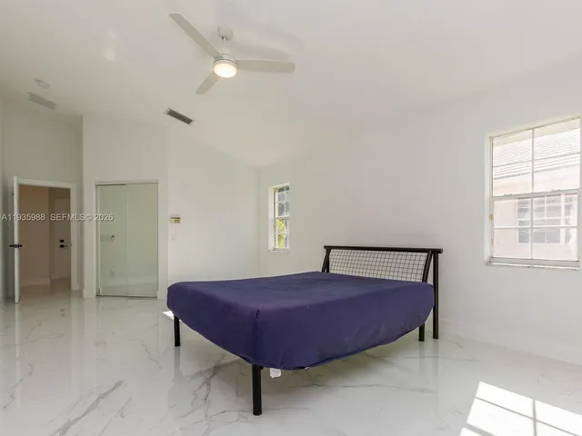 a bathroom with a sink a light fixture and a mirror
