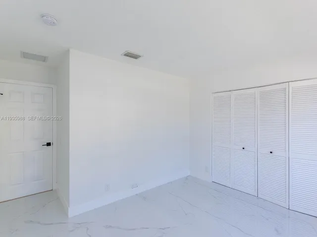 a view of a lake with houses in the back