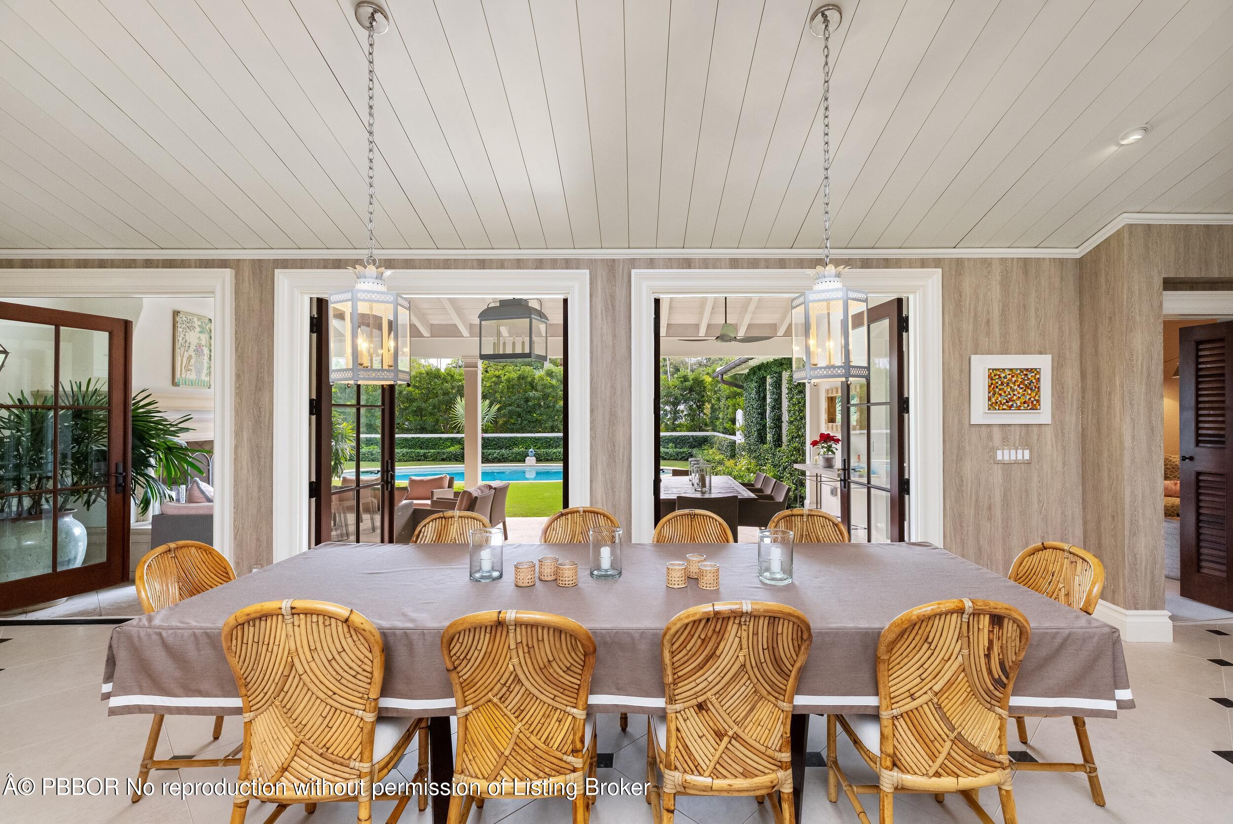 258 List Road Palm Beach, FL 33480 - Photo 8 of 45 a dining room with furniture and a large window