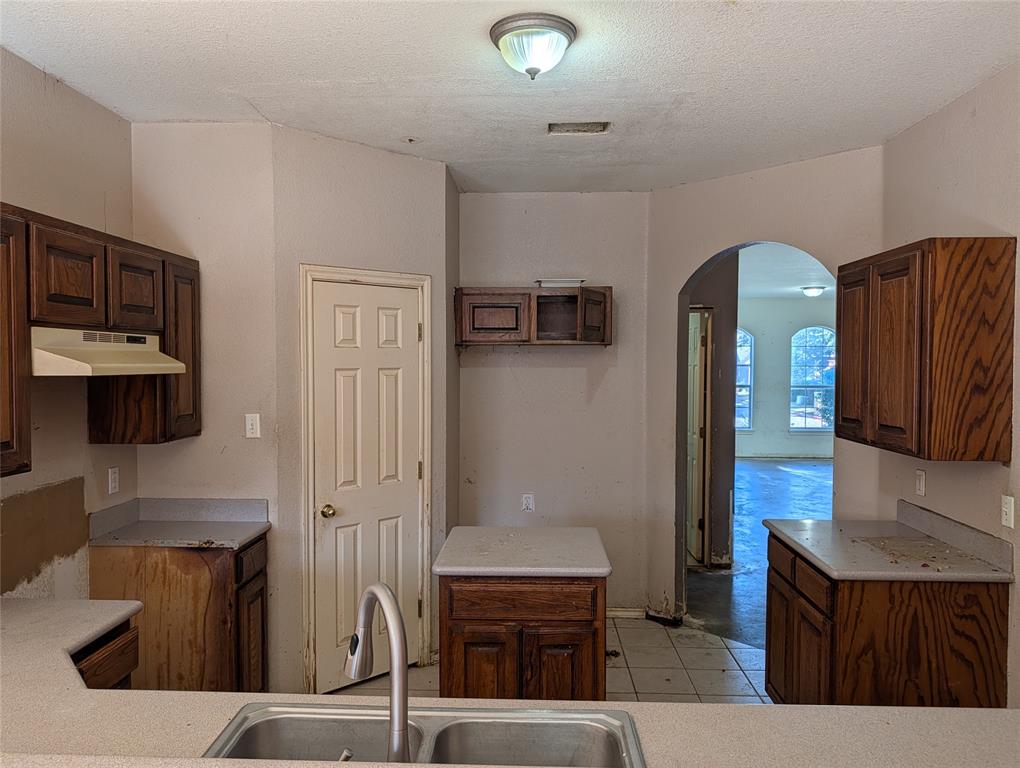 2301 Springmere Drive Arlington, TX 76012 - Photo 11 of 34 a kitchen with stainless steel appliances granite countertop a refrigerator and a stove top oven
