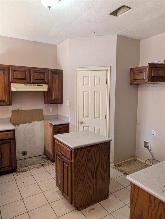 2301 Springmere Drive Arlington, TX 76012 - Photo 12 of 34 a kitchen with a sink and cabinets