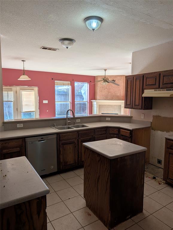 2301 Springmere Drive Arlington, TX 76012 - Photo 13 of 34 a kitchen with a sink stove and cabinets