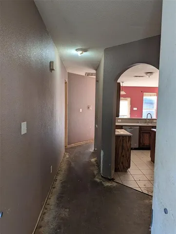a view of a hallway with a bathroom