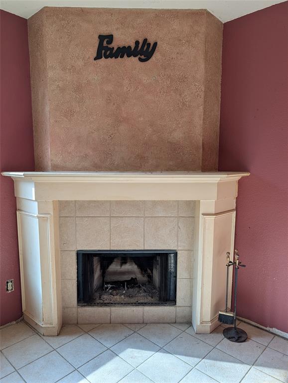 2301 Springmere Drive Arlington, TX 76012 - Photo 7 of 34 a living room with a fireplace