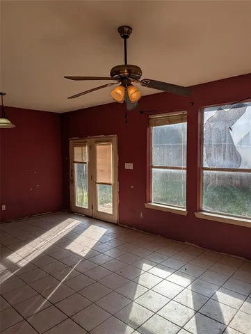 a view of empty room with windows