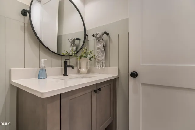 a view of a room with wooden floor and white walls