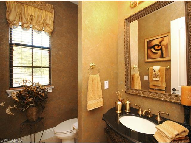 1491 Oakes Boulevard Naples, FL 34119 - Photo 12 of 15 a bathroom with a granite countertop sink mirror and a toilet