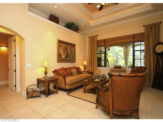 1491 Oakes Boulevard Naples, FL 34119 - Photo 2 of 15 a living room with furniture and a large window