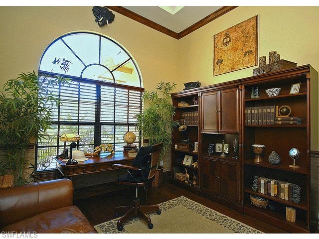 1491 Oakes Boulevard Naples, FL 34119 - Photo 7 of 15 a living room with furniture a floor to ceiling window and a flat screen tv
