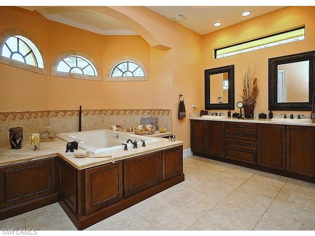 1491 Oakes Boulevard Naples, FL 34119 - Photo 9 of 15 a kitchen with a sink and cabinets