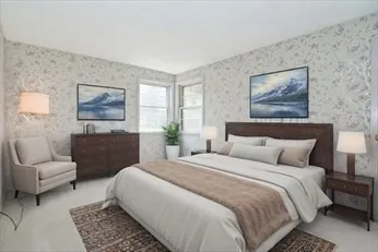 a spacious bedroom with a bed and a couch