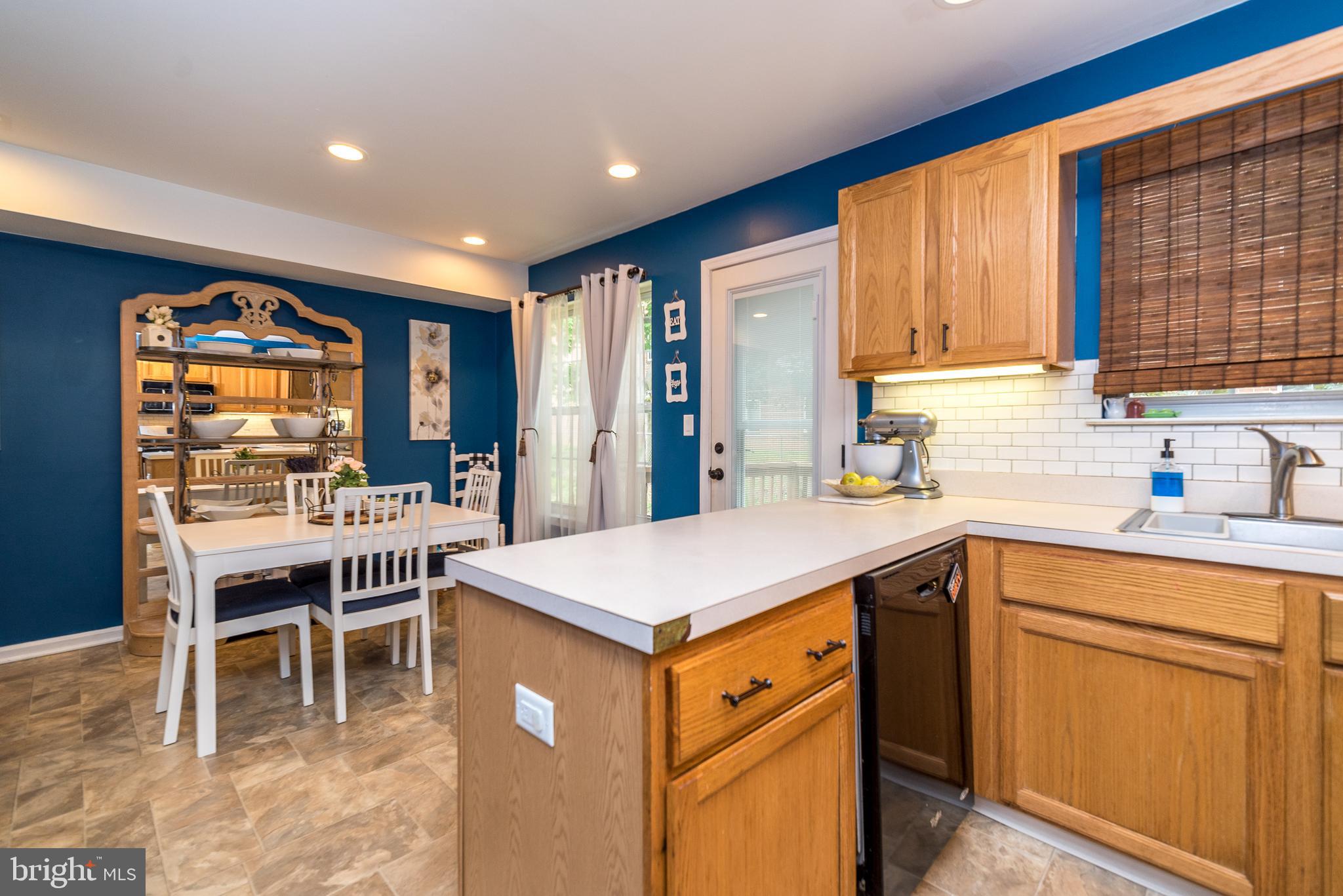 7923 Ridge Avenue, Unit 39 Philadelphia, PA 19128 - Photo 14 of 32 Kitchen with access to outside deck