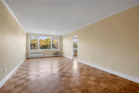 a view of an empty room with a window