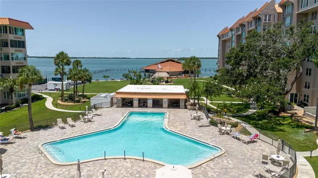 a view of a house with swimming pool and sitting area