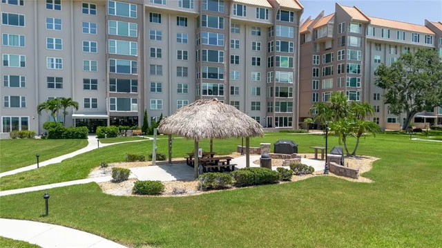 a view of a house with garden and sitting area