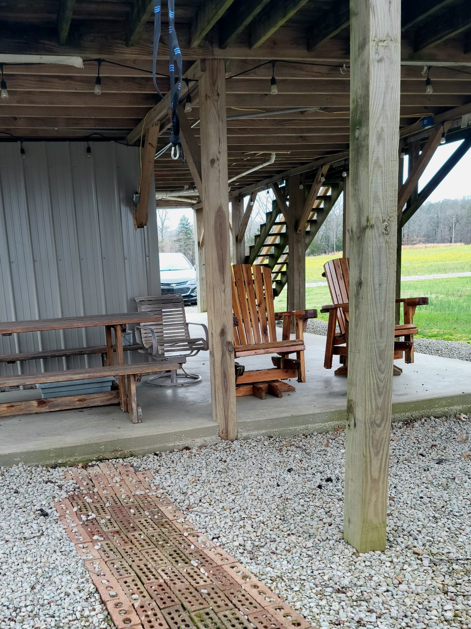 485 Creekside View Lane Decaturville, TN 38329 - Photo 12 of 31 a view of a backyard with table and chairs