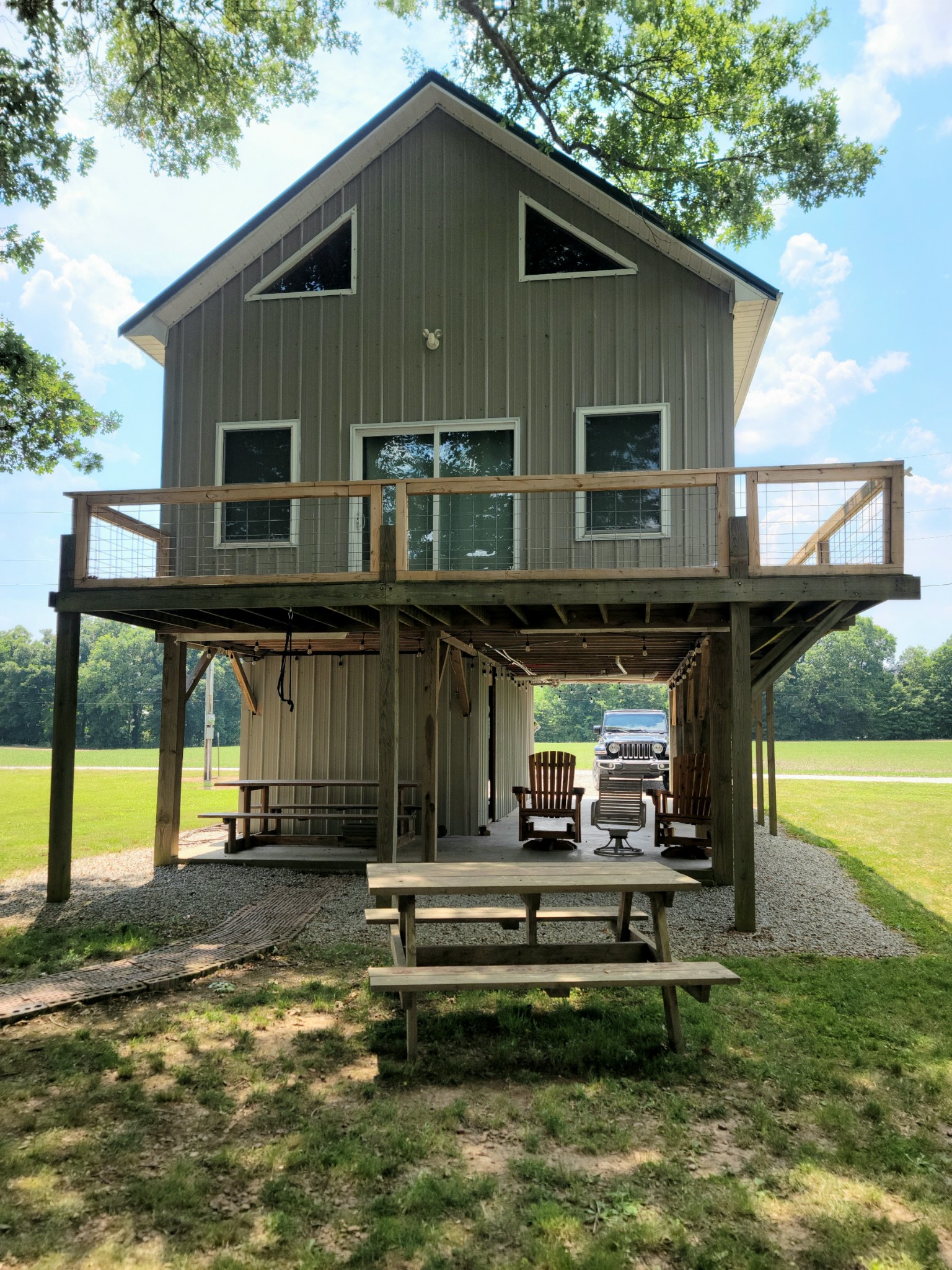 485 Creekside View Lane Decaturville, TN 38329 - Photo 15 of 31 a view of a house with a yard and furniture
