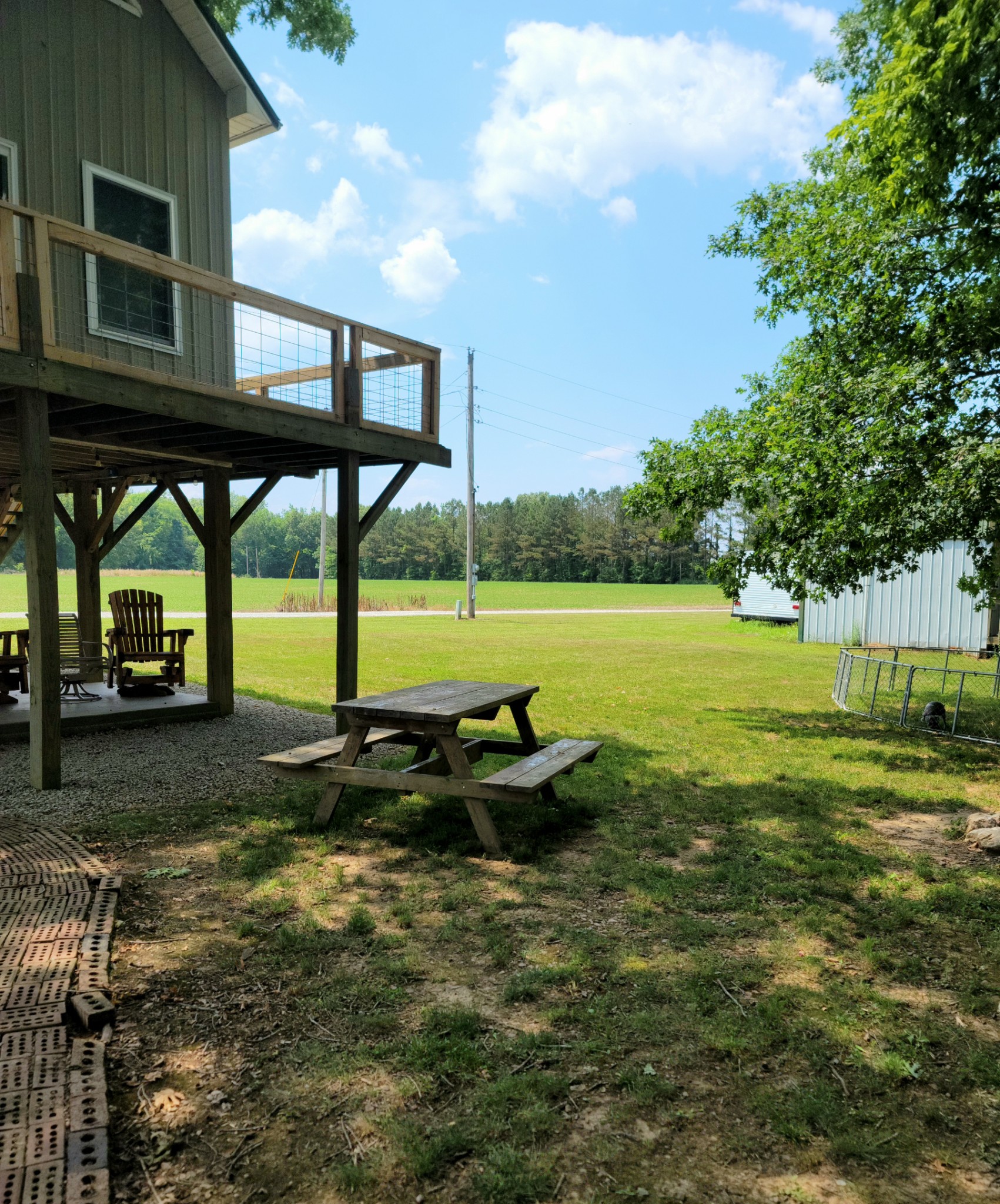 485 Creekside View Lane Decaturville, TN 38329 - Photo 18 of 31 a backyard of a house with table and chairs