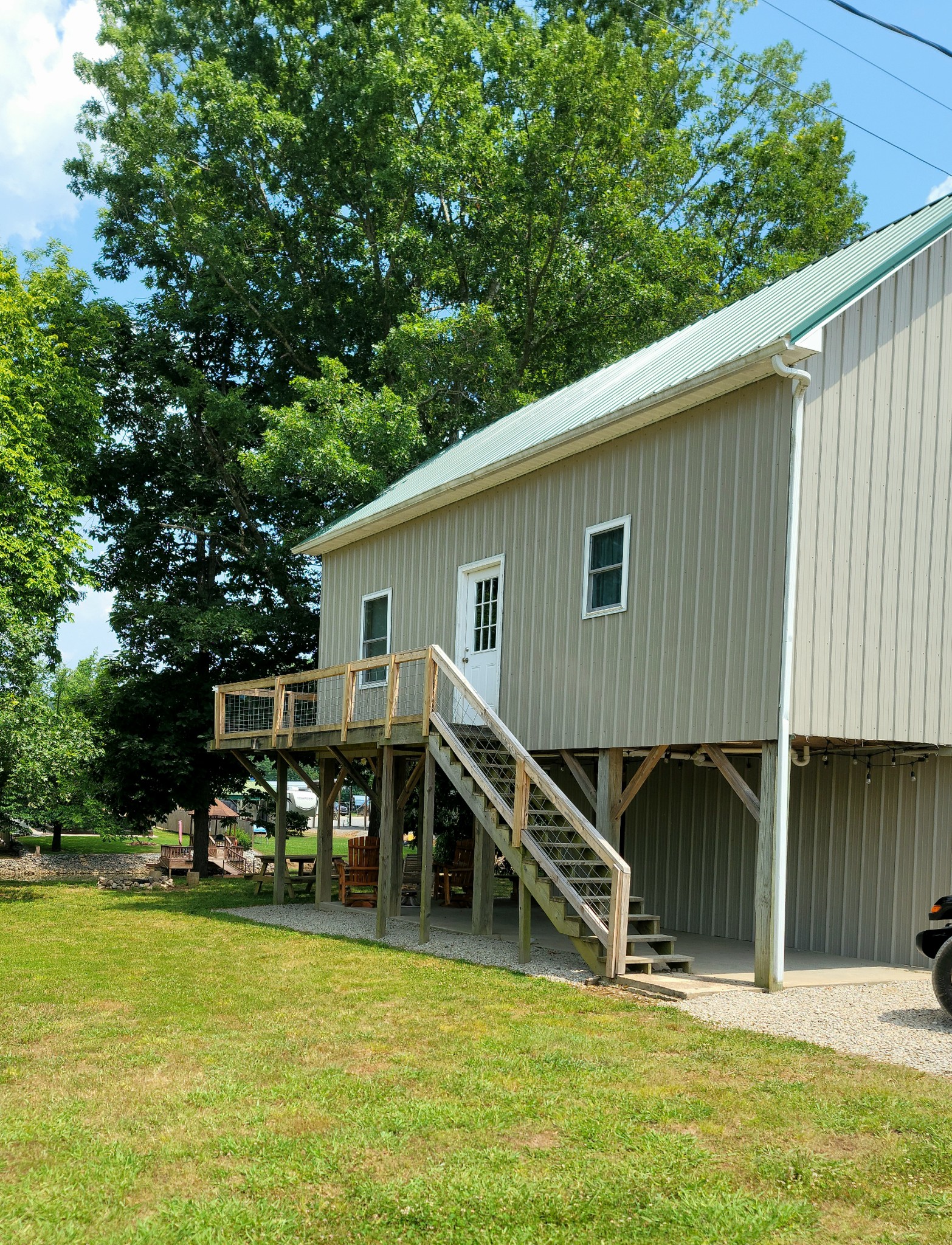 485 Creekside View Lane Decaturville, TN 38329 - Photo 26 of 31 a view of a house with wooden floor and a yard