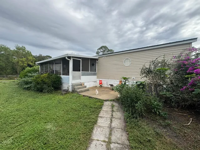 a view of a lake with houses in the back