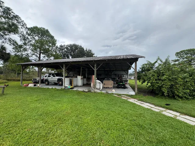 a view of a garden with a building in the background