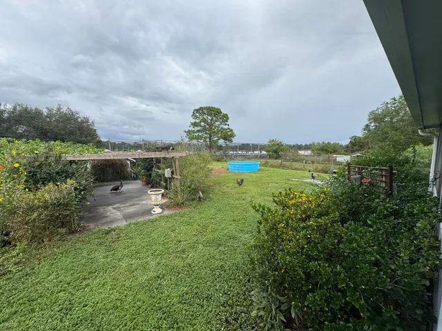a workspace with furniture and a chandelier