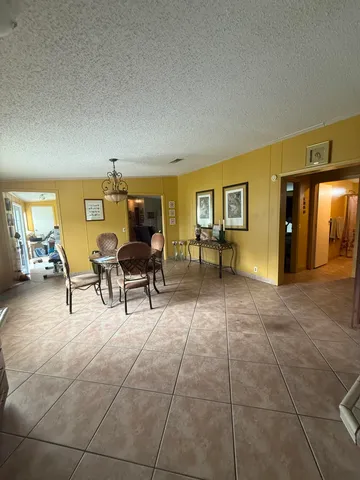 a view of living room with furniture and a window