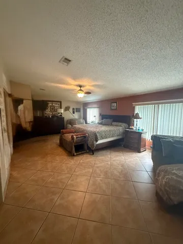 a bathroom with double vanity and a mirror