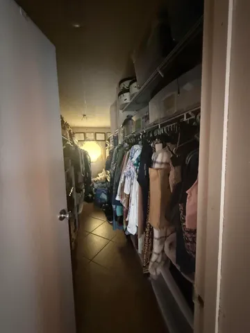 a bedroom with a bed and dresser