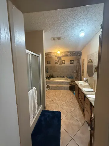 a kitchen with a stove a refrigerator and a microwave