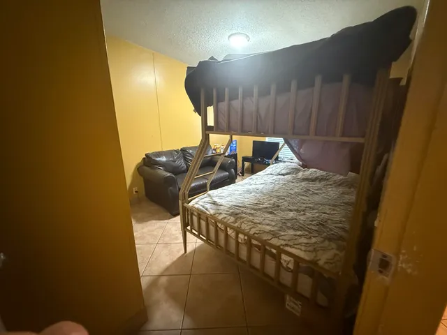 a kitchen with a stove a refrigerator and a microwave