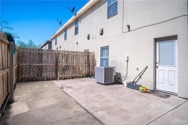a view of a deck with wooden floor and fence
