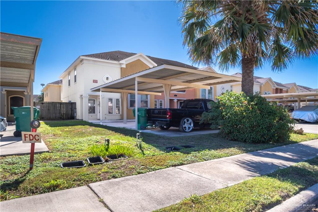 1309 West Fig Avenue, Unit A Pharr, TX 78577 - Photo 2 of 15 a front view of a house with swimming pool having outdoor seating