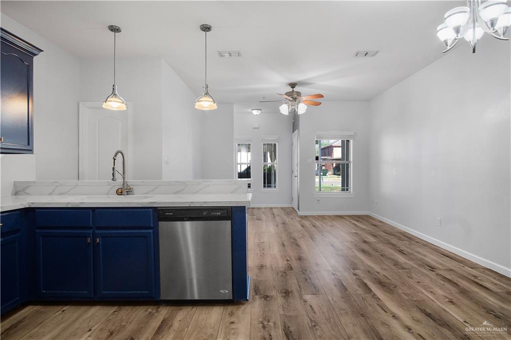 1309 West Fig Avenue, Unit A Pharr, TX 78577 - Photo 7 of 15 a kitchen with a sink and chandelier