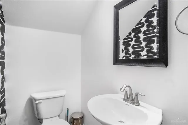 a bathroom with a toilet and a sink