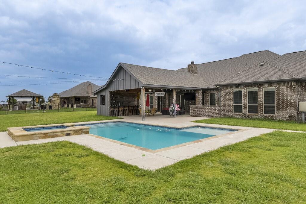 239 North Armstrong Road Venus, TX 76084 - Photo 30 of 39 Outdoor living space featuring a rectangular swimming pool with an integrated spa