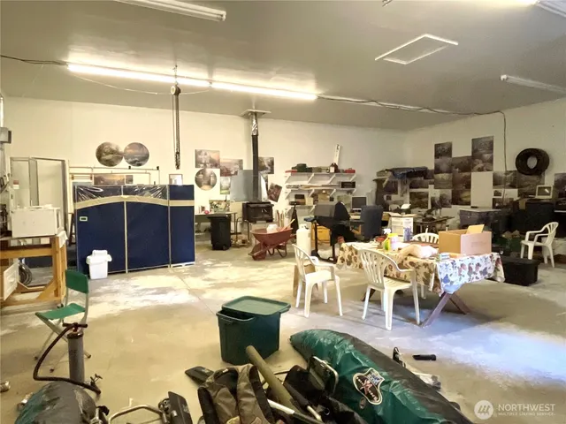 a room with lots of chairs and mirrors