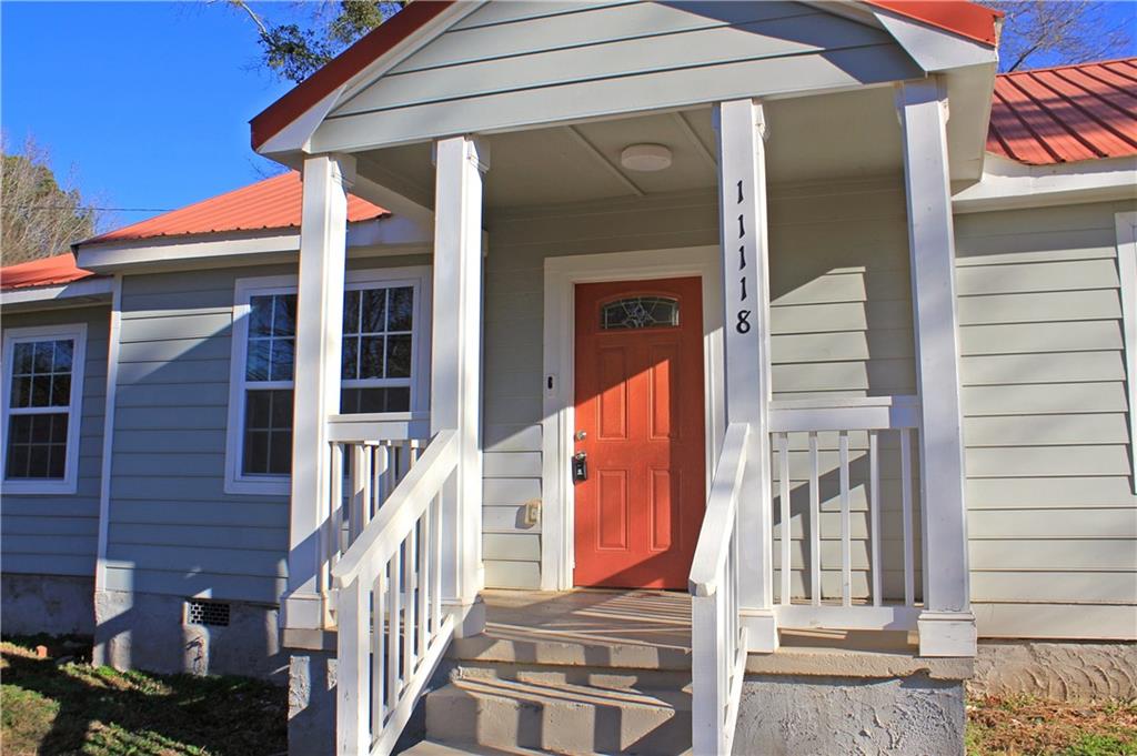 11118 City Pond Road Covington, GA 30014 - Photo 2 of 24 a view of a house with a small porch