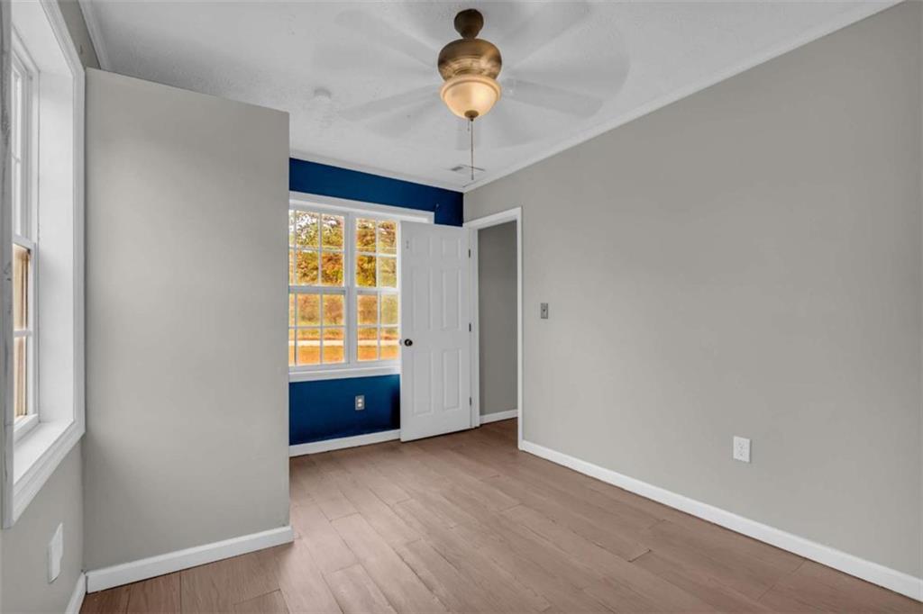 11118 City Pond Road Covington, GA 30014 - Photo 6 of 24 a view of an empty room with a window