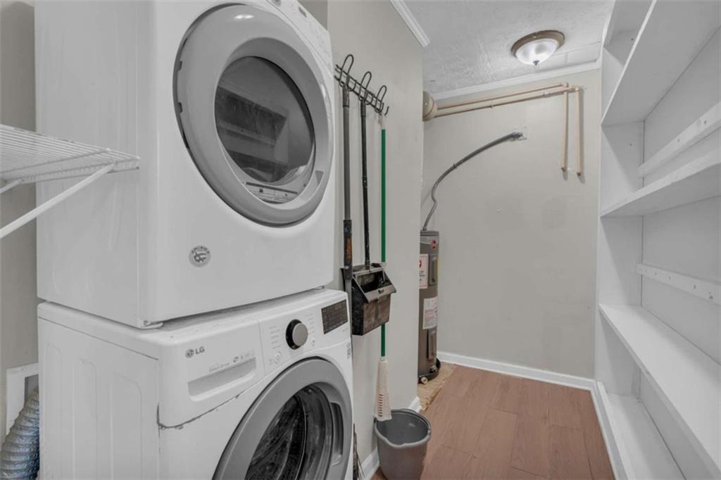 11118 City Pond Road Covington, GA 30014 - Photo 7 of 24 a utility room with dryer and washer