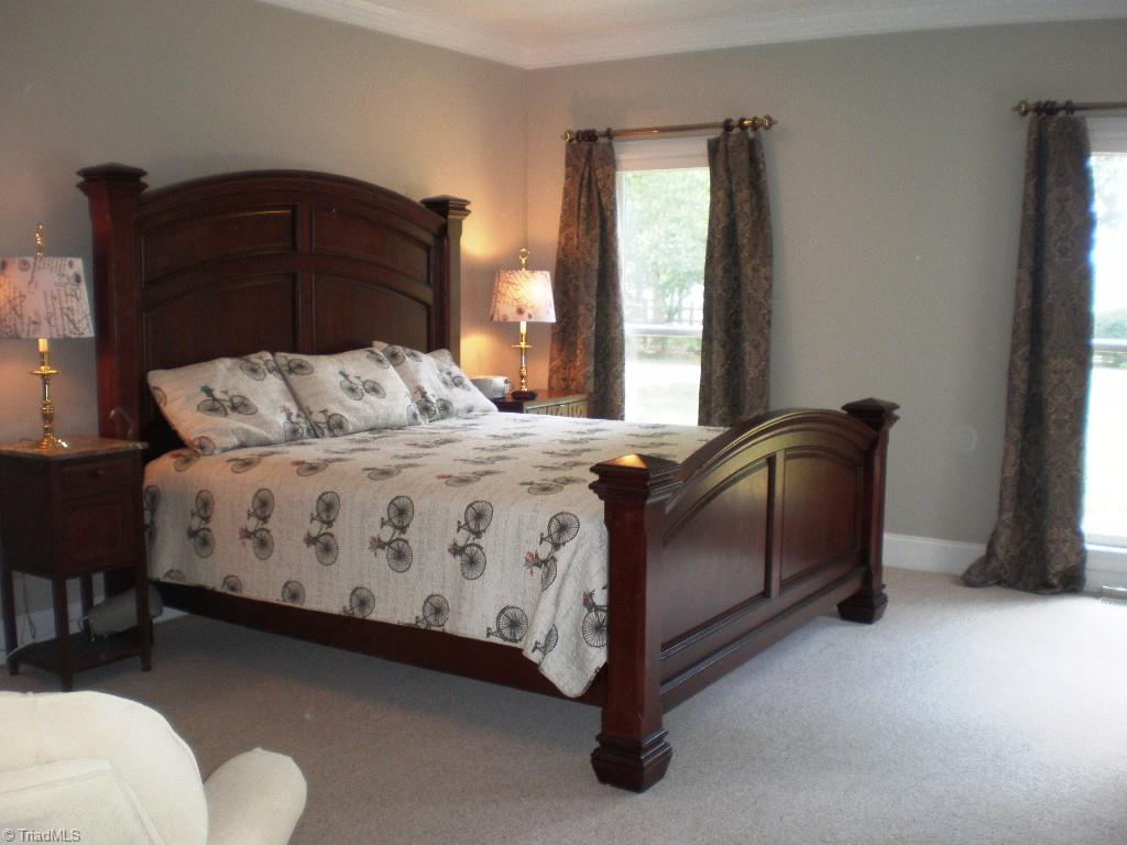 8506 Case Ridge Drive Oak Ridge, NC 27310 - Photo 16 of 30 Large Master Bedroom with Door Leading to Deck