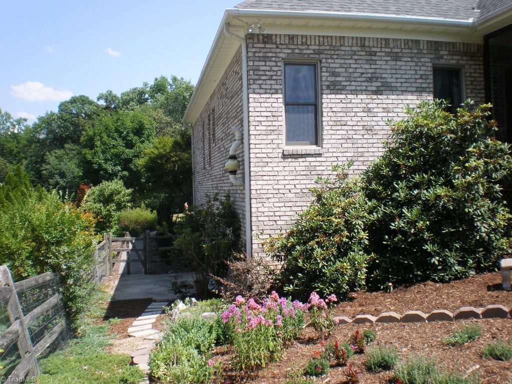 8506 Case Ridge Drive Oak Ridge, NC 27310 - Photo 5 of 30 Freshly Mulched Landscape Beds